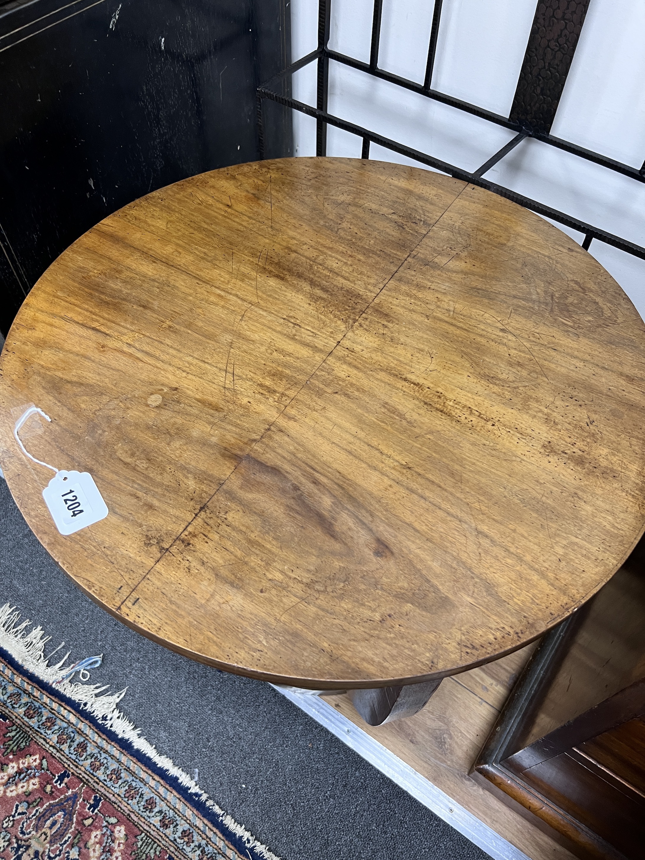 A French Art Deco walnut occasional table, diameter 59cm, height 56cm